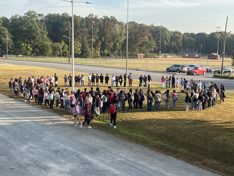 students at the flagpole