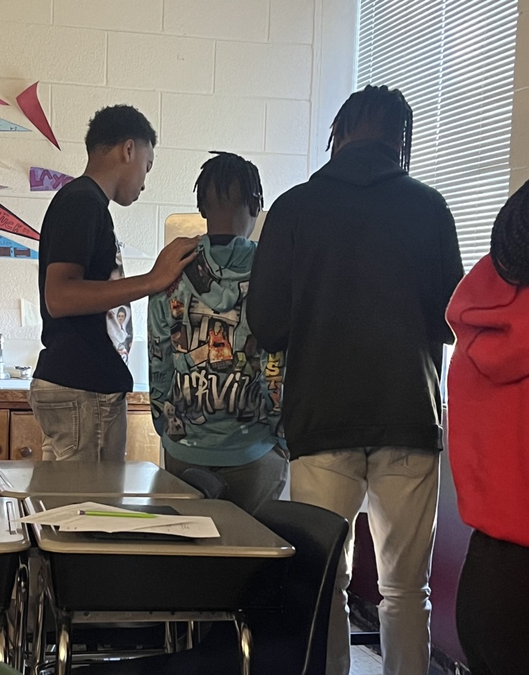 students supporting each other in class