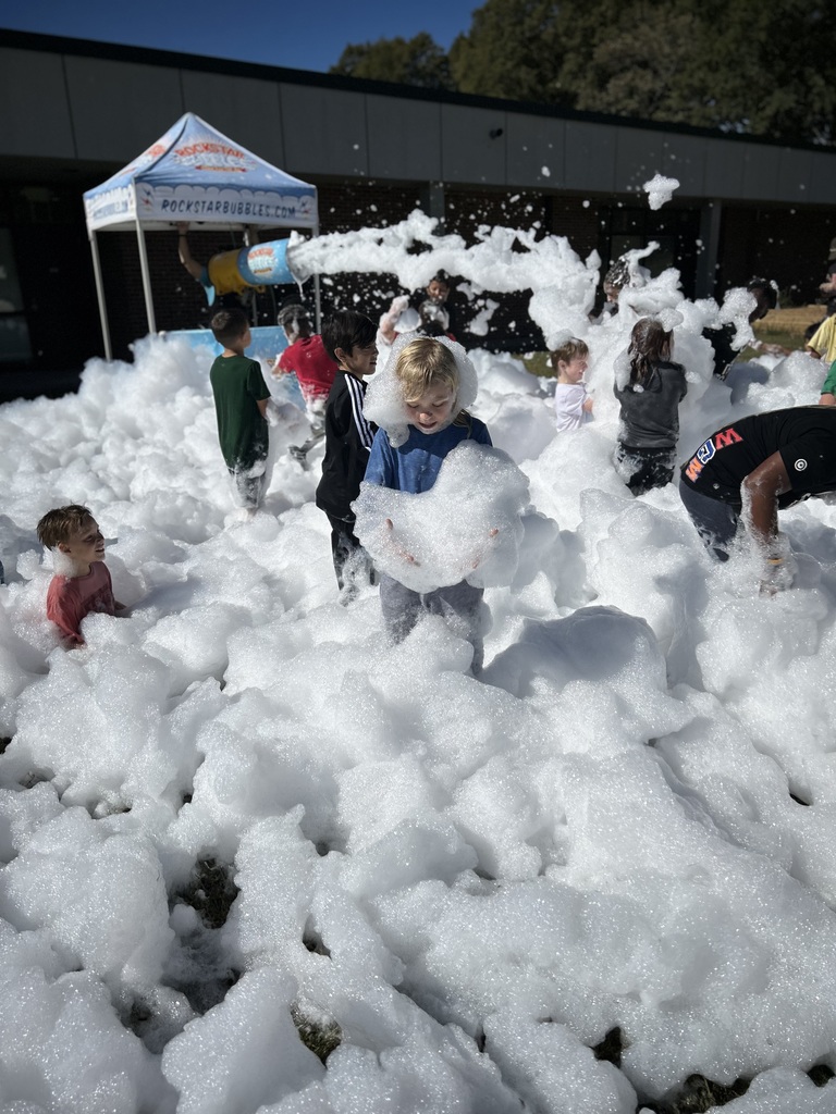 a group of students are seen covered in foam