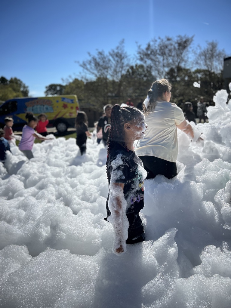 two female students stand in foam
