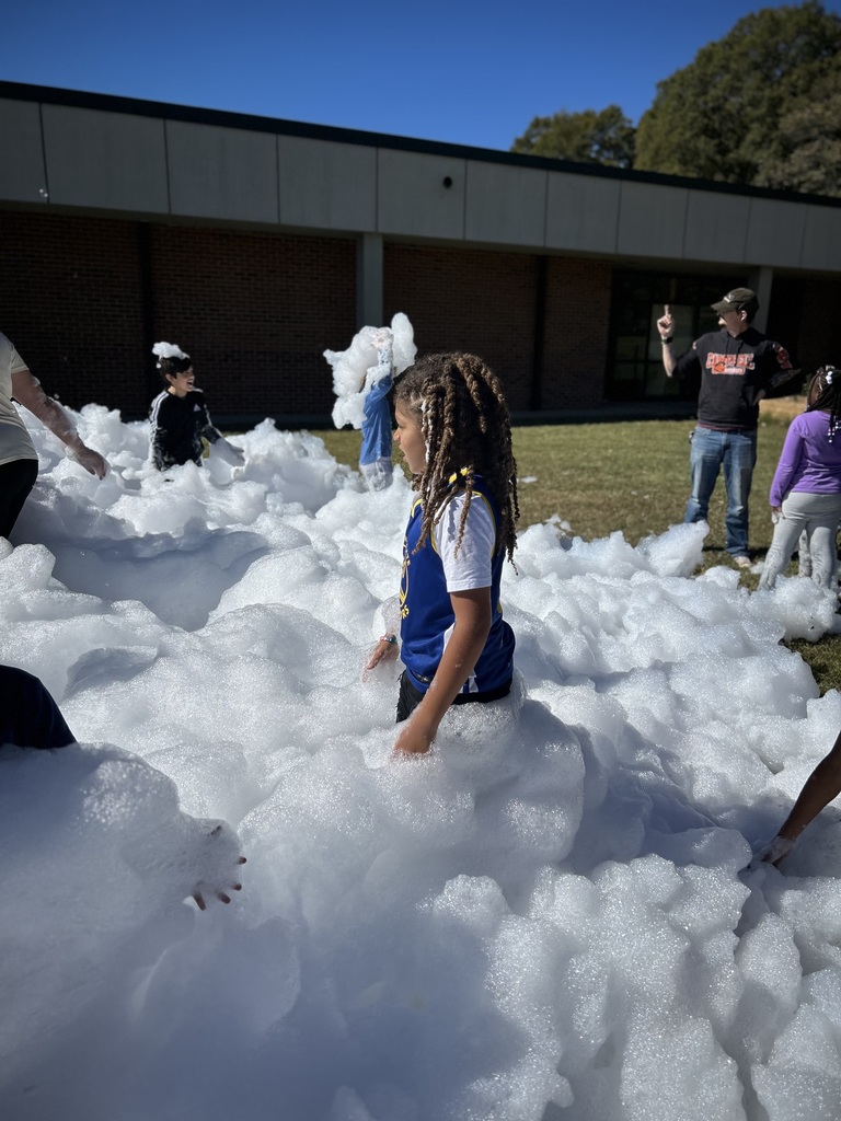 male student stands in foam. 