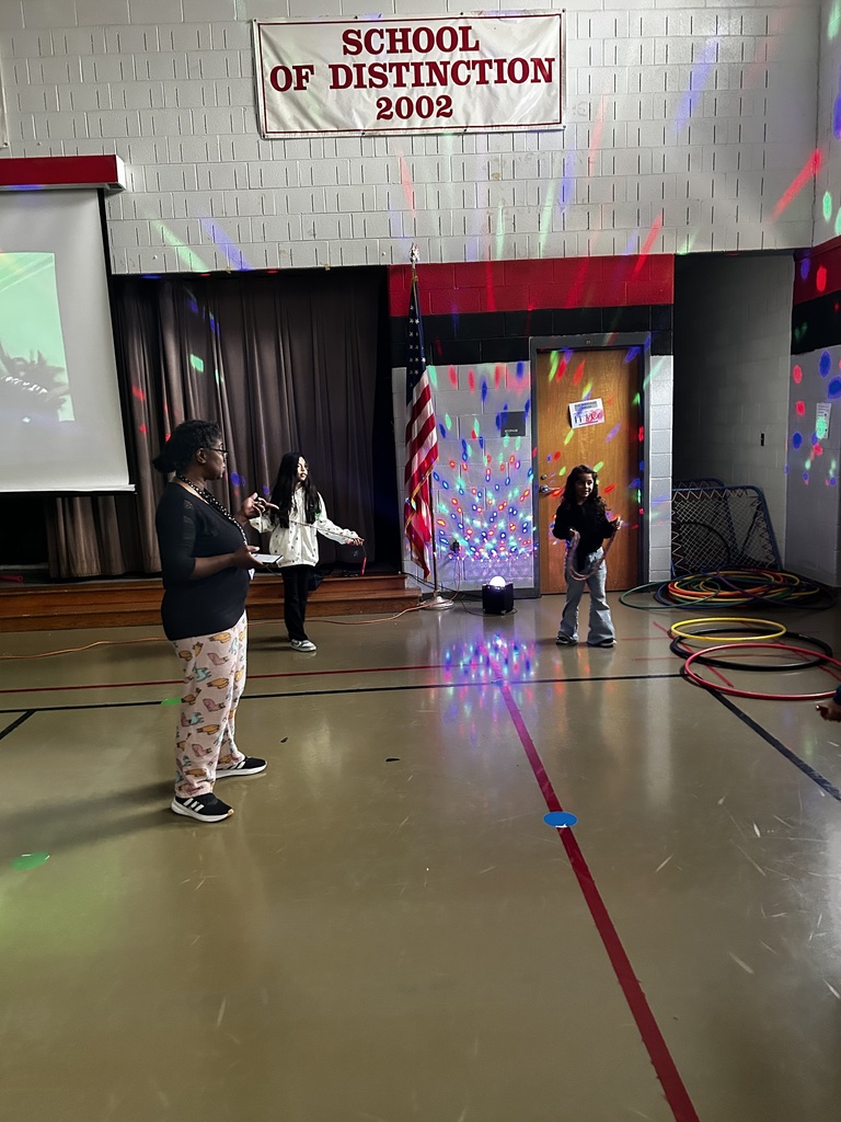 Students and teacher participate in dance party in the dark 