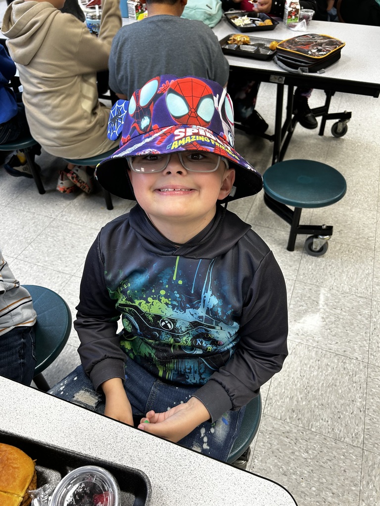 Student wears bucket hat and glasses