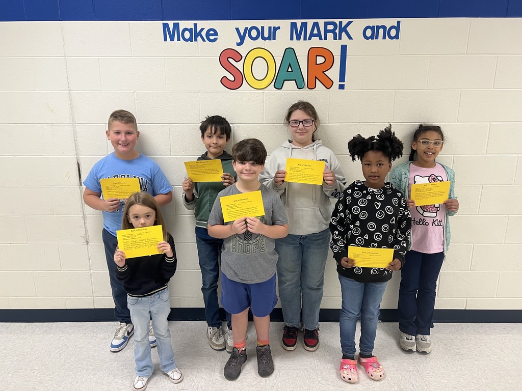 Kids of character holding up their shout out cards recognizing how they showed respect for the month of October.
