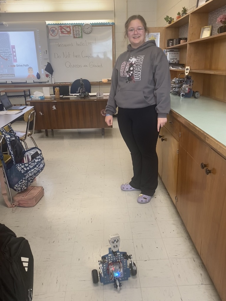 Students working with robots in computer science discoveries class