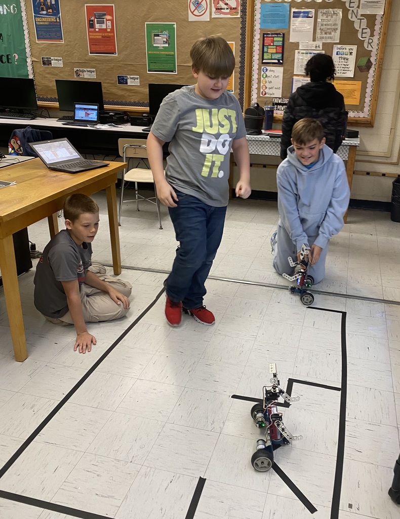 Students working with robots in computer science discoveries class