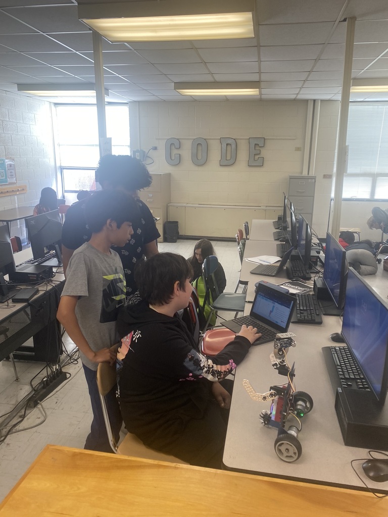 Students working with robots in computer science discoveries class