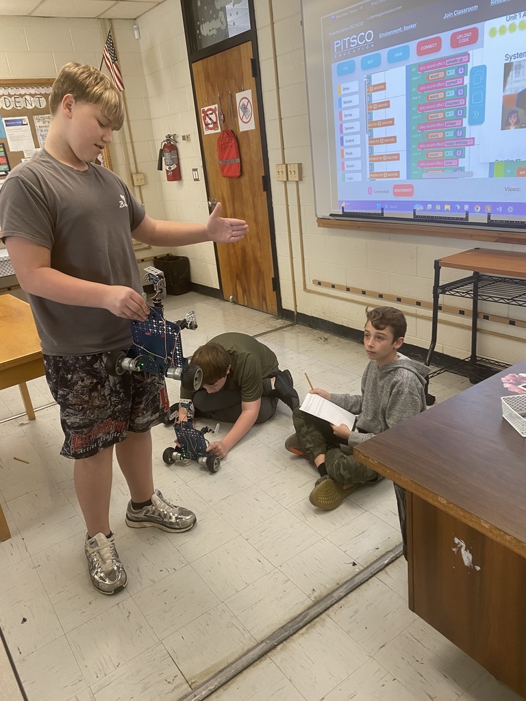 Students working with robots in computer science discoveries class