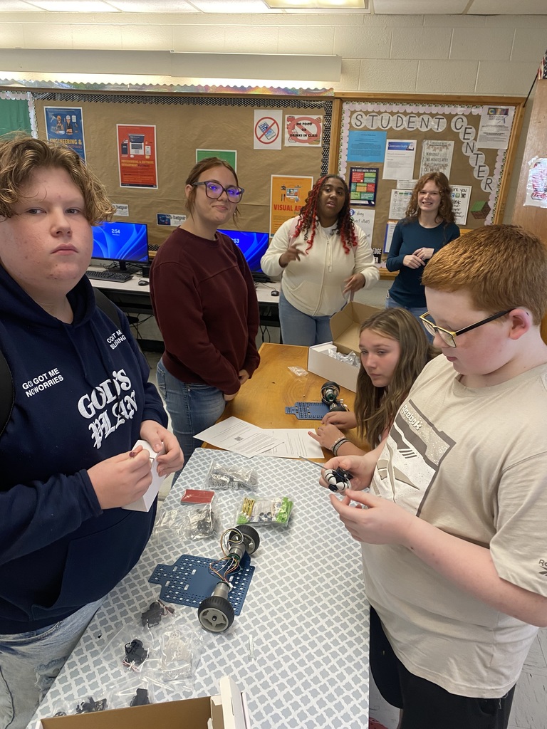 Students working with robots in computer science discoveries class