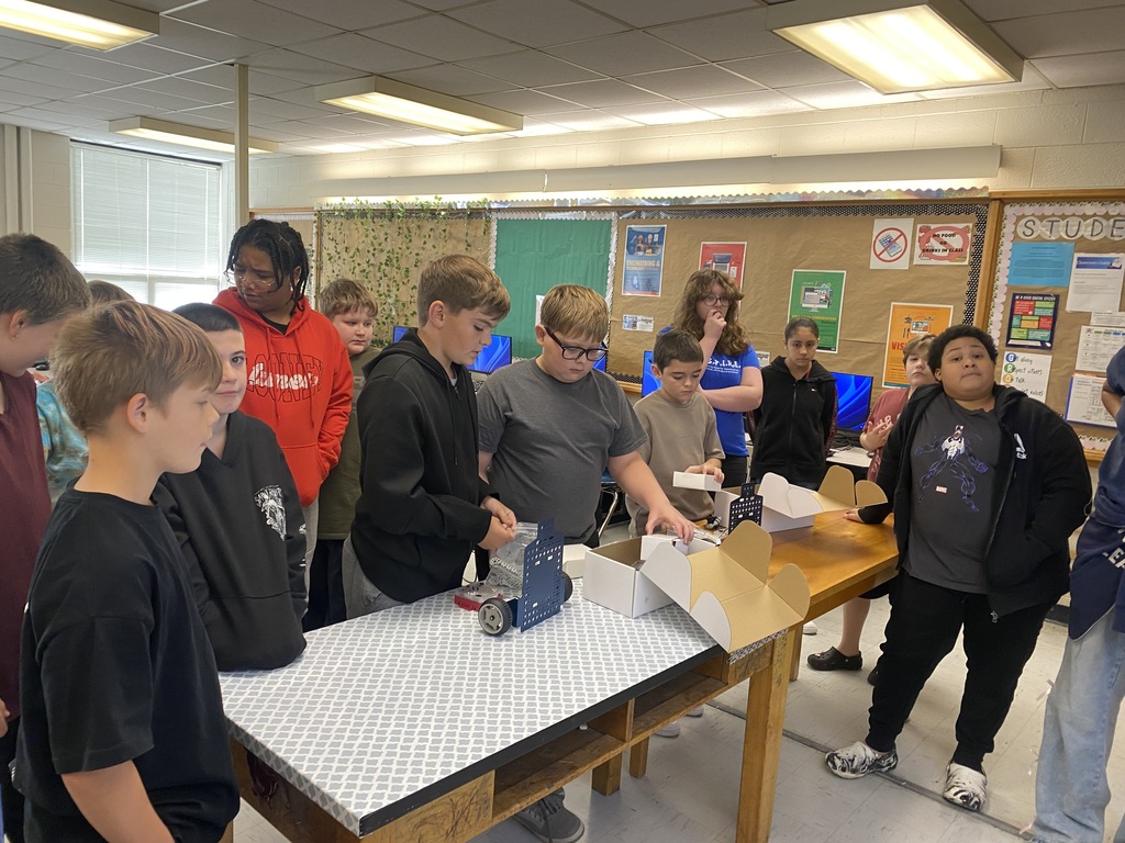 Students working with robots in computer science discoveries class