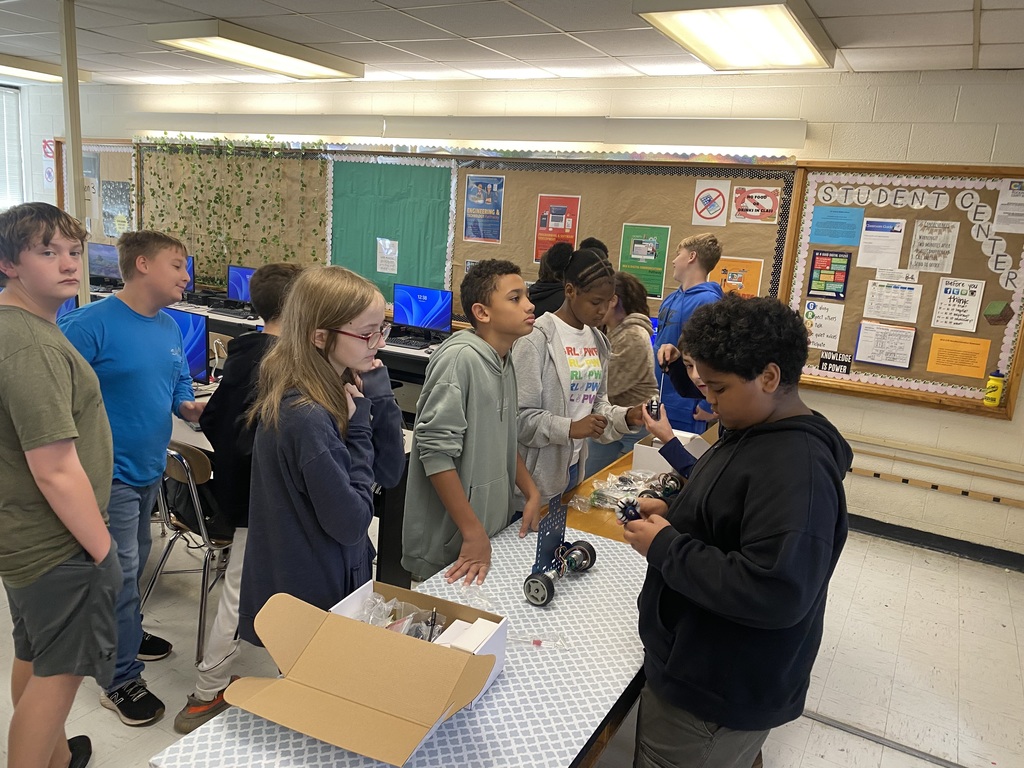 Students working with robots in computer science discoveries class