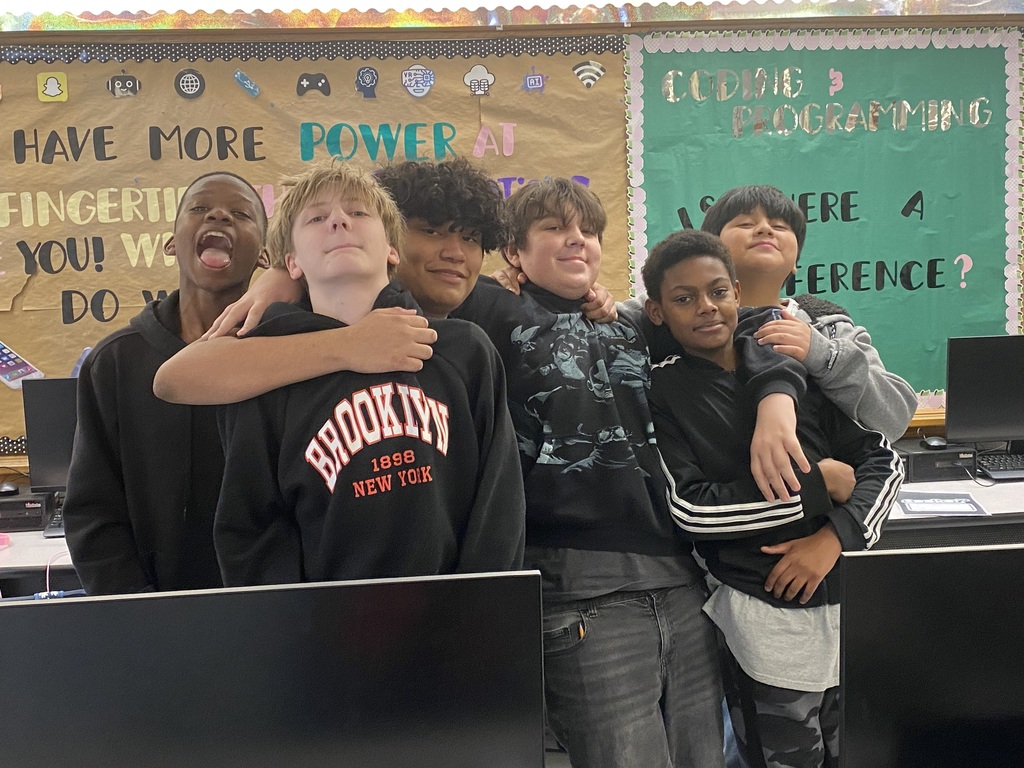 Kids working with robots in computer science discoveries