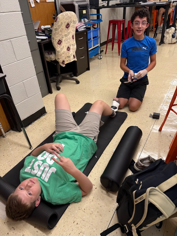 Students practicing ankle wrapping in sports medicine