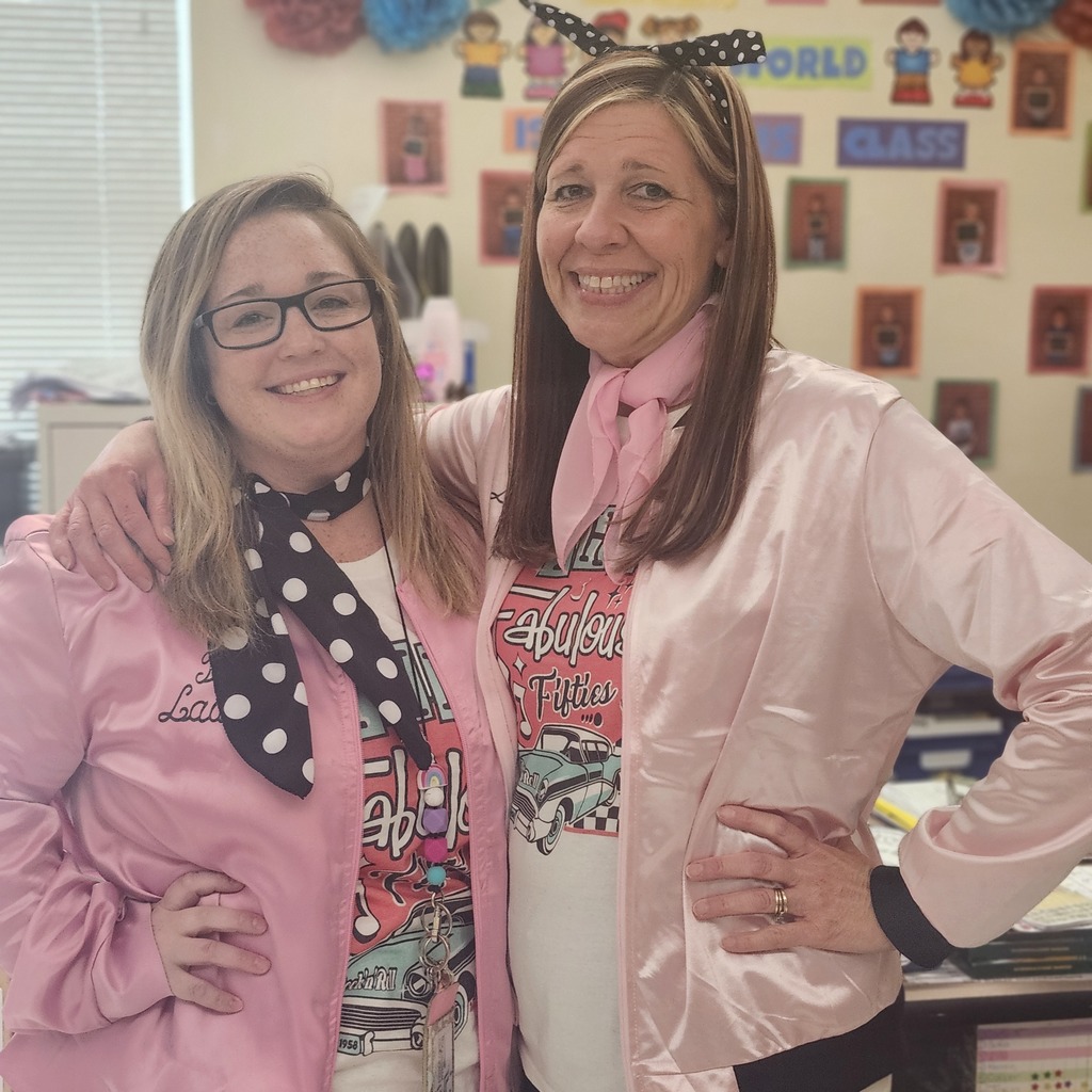 Mrs. Carter and Mrs. Cox dressed up as pink ladies.