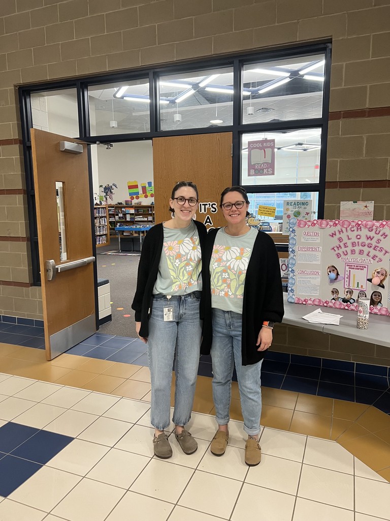 Ms. Murray and Mrs. Minuci twinning in florals and black cardigans for twin day!