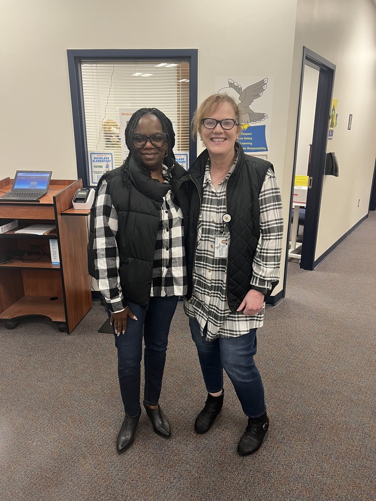 Mrs. Johnson and Mrs. Trantham twinning in black and white checkered shirts and black vests for twin day!