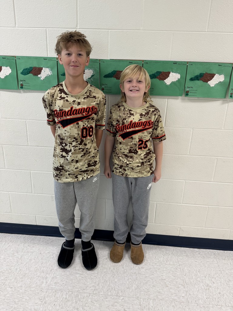 Two 5th grade boys wearing baseball camo shirts for twin day