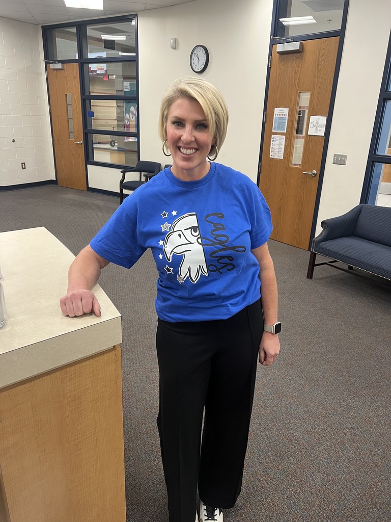 Dr. Cassell wearing a Douglass Eagles shirt.