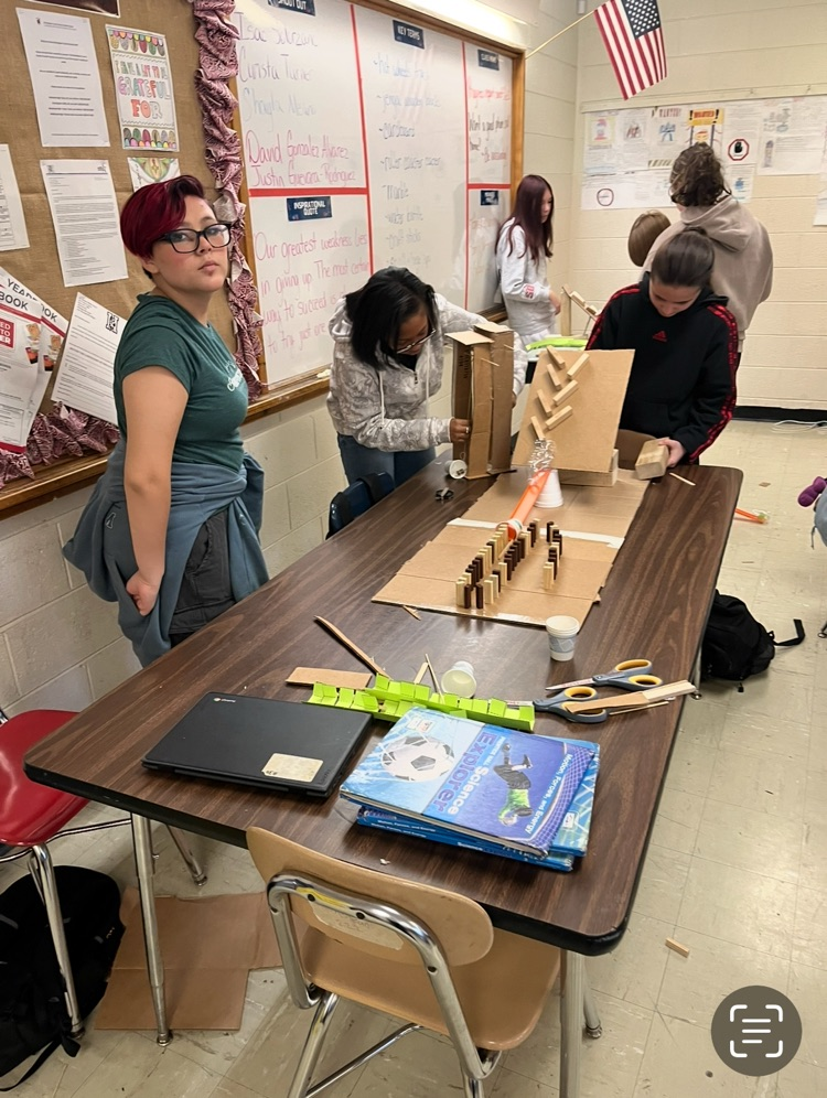students making Rube Goldberg machines