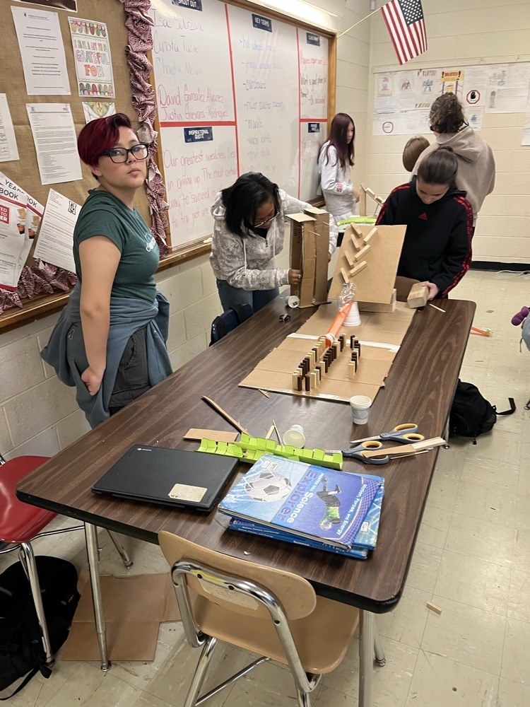 students making Rube Goldberg machines