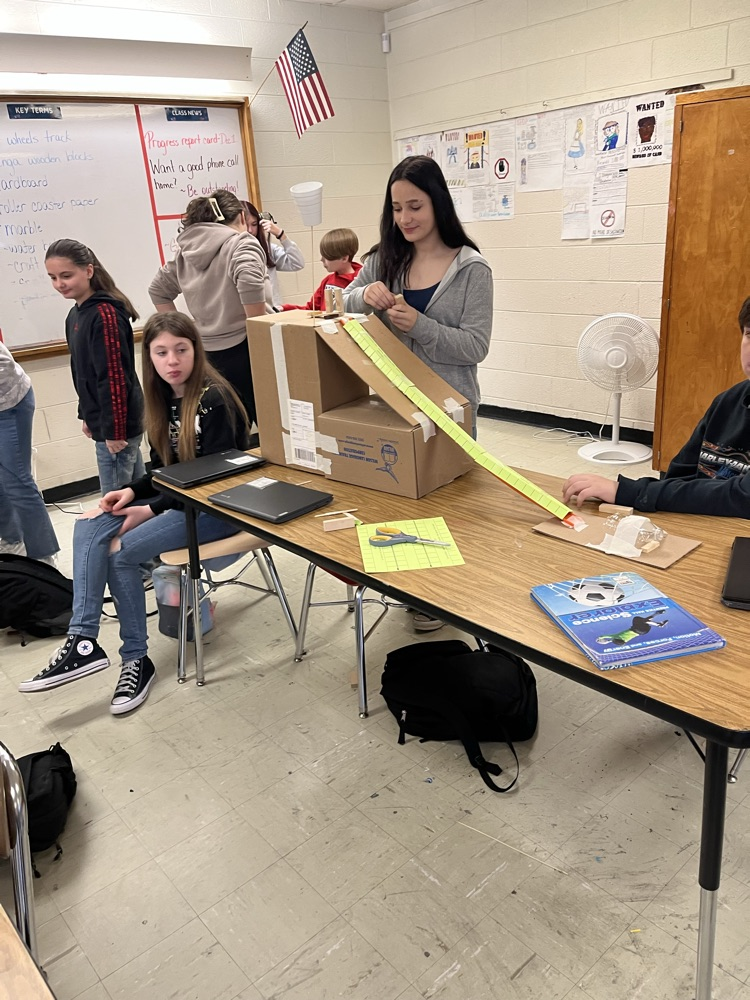 students making Rube Goldberg machines