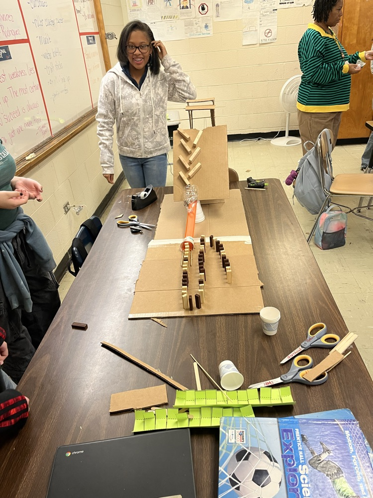students making Rube Goldberg machines