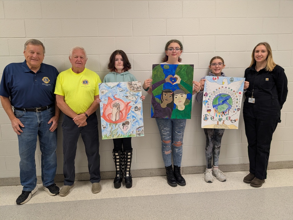 students with posters and Lions club representatives