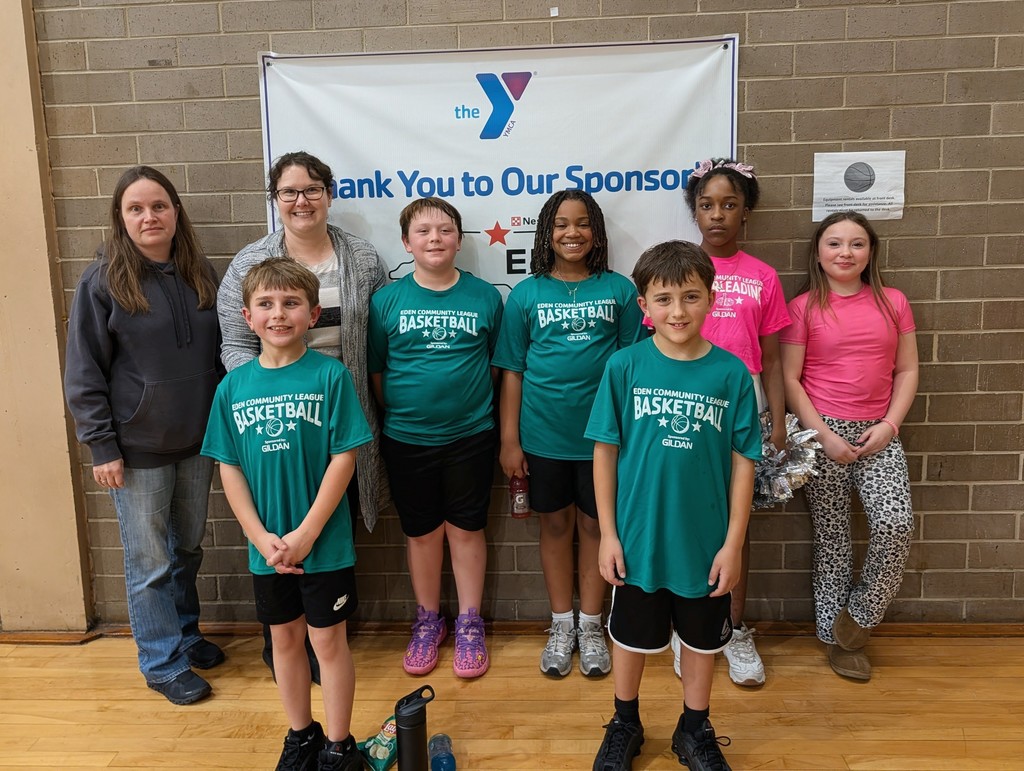 Mrs. Holley and Mrs. Hinson  with some 4th graders at their basketball game.