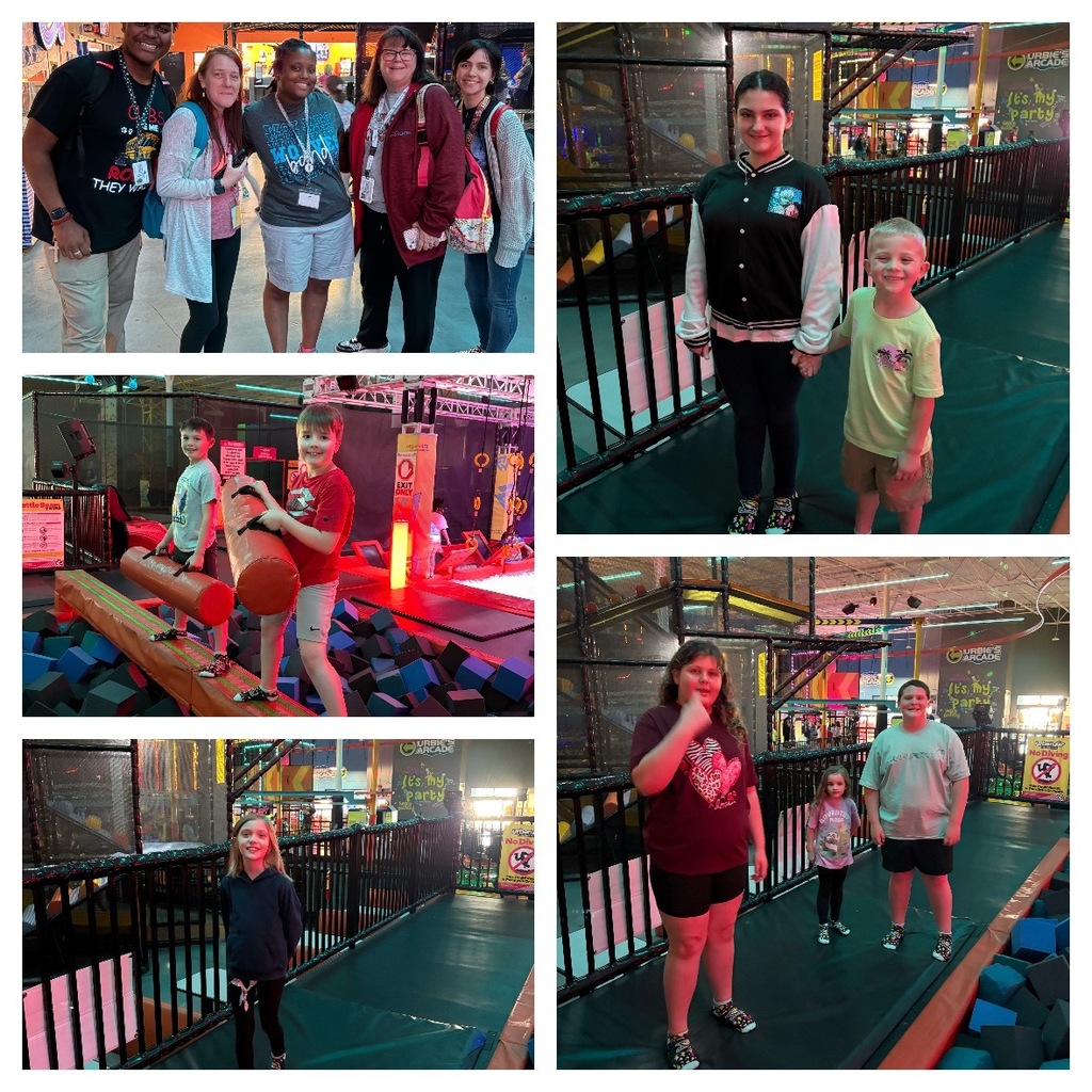 Alt Text: A five-photograph collage captures adults and children enjoying activities at an indoor entertainment venue combining trampoline park and arcade elements, with signage reading "URBIE'S ARCADE" and "It's my party" visible throughout. Top Left: Six adults—three men and three women—stand together smiling at the camera at an indoor event. Some wear shirts with text including "GLOBE, They Want" and "MOM." Display booths are visible in the blurred background, and a "WELCOME" sign is displayed. Top Right: A teenage girl and a young boy stand side-by-side holding hands on a padded walkway inside the adventure park. Multi-level climbing structures and trampolines are visible in the background. Middle Left: Two young boys actively participate in an obstacle course. One boy in a white shirt is positioned behind a wooden log obstacle, while another boy in a red shirt holds a padded orange log while standing on soft foam blocks in a foam pit area. An "EXIT ONLY" sign and partially visible "Battle" sign are visible in the background. Bottom Right: Three females of varying ages—one adult/teen and two younger girls—stand on a padded surface, likely a trampoline or padded pathway, within the adventure park setting. A yellow and black "No Div" (No Diving) safety sign is visible. Bottom Left: A young girl with long hair stands on a padded walkway in the indoor adventure park, smiling at the camera. Additional park structures are visible in the background. Overall Setting: The venue features multi-level climbing structures, trampolines, foam pit areas, padded walkways and surfaces, and obstacle course elements, creating a comprehensive indoor entertainment and recreation facility.