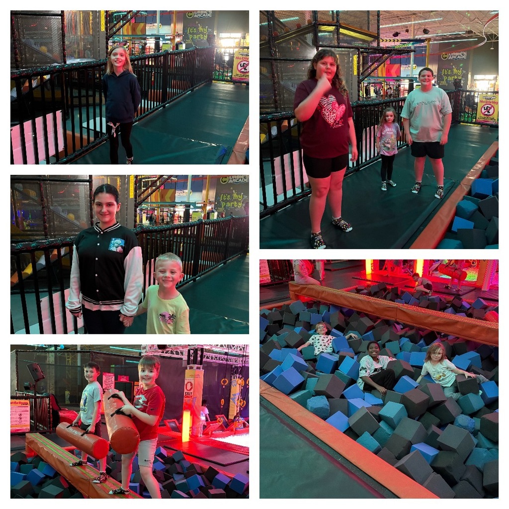 Alt Text: A five-photograph collage showcases children enjoying various activities at Urban Air Adventure Park, an indoor multi-level adventure facility. Elevated Walkway Photos: Multiple images capture children standing on elevated walkways with protective black railings, overlooking different sections of the facility. Signs visible in the background read "URBAN AIR ARCADE" and "It's my party," indicating party and entertainment areas. Safety signage is also visible, including a circular red "No Diving" sign with a diagonal line, a "WARNING" sign, and an "EXIT ONLY" sign. Partially visible text reads "WARRIOR," likely part of an attraction or activity name. Foam Pit Activities: Other photographs show children immersed in a large pit filled with numerous black and blue foam cubes. Some children are relaxing and playing within the foam pit, while others are engaged in balance beam and padded jousting pole activities positioned over the foam. The children appear to be enjoying interactive games and physical challenges. Overall Environment: The facility features vibrant, colorful structures, protective nets, and illuminated elements throughout, creating a dynamic and engaging play space. The multi-level design with elevated platforms and interconnected play areas suggests a comprehensive indoor adventure park designed for active recreation and entertainment.