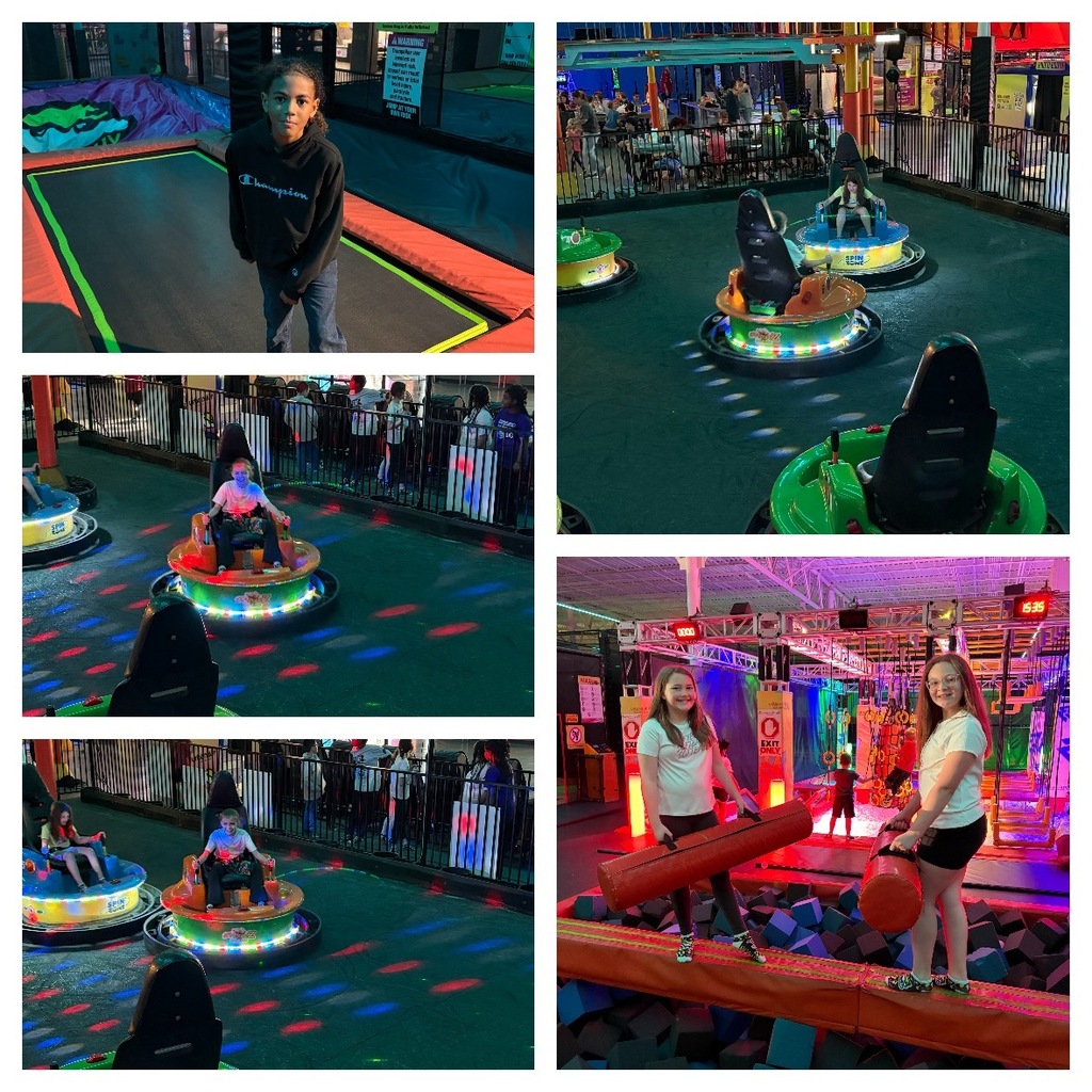 Alt Text: A five-photograph collage showcases various activities at an indoor adventure park featuring trampolines, bumper cars, and obstacle course challenges. Top Left: A young person with curly hair stands on a rectangular trampoline wearing a black Champion hoodie and jeans. The trampoline features a green perimeter and yellow dividing line. Padded play areas and a warning sign are visible in the background of the indoor facility. Top Right: An aerial view captures an indoor bumper car arena with multiple colorful spin zone bumper cars in green, orange, and blue positioned on a dark floor. Some cars are occupied by people. The floor is illuminated with red, blue, and white disco lights. A crowd of spectators stands behind a railing on an elevated platform in the background. Middle Left: A close-up shows two people seated in spin zone bumper cars—one orange and one blue—on a dark floor illuminated by red and blue disco lights. The person in the orange car smiles at the camera. The bumper car displays "SPIN ZONE" text on its side. People stand behind a black railing in the background watching the activity. Bottom Left: Similar to the middle-left image, two people are seated in spin zone bumper cars—one orange and one blue—on a dark floor with red and blue disco lights. Spectators are visible behind a railing in the background. Bottom Right: Two girls or young women stand on a narrow orange balance beam suspended over a large foam pit filled with blue and grey foam cubes. Both hold long red padded logs for a jousting or balance challenge. In the background, a brightly lit obstacle course or ninja warrior-style setup features colorful components, signs including an "EXIT" sign, and a digital timer displaying "15:35."