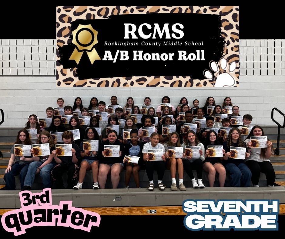 7th grade A/B honor roll students posing on bleachers with certificates