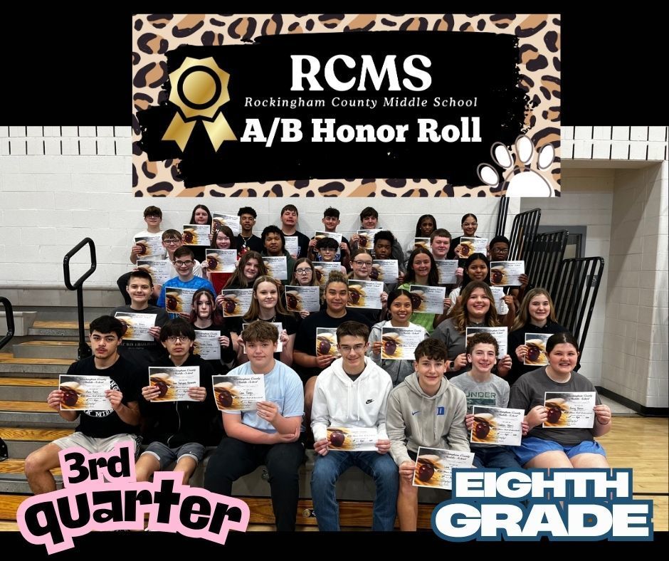 8th grade A/B honor roll students posing on bleachers with certificates