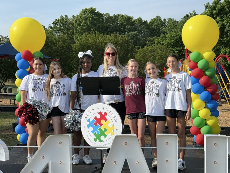 cheerleaders and coach Grogan