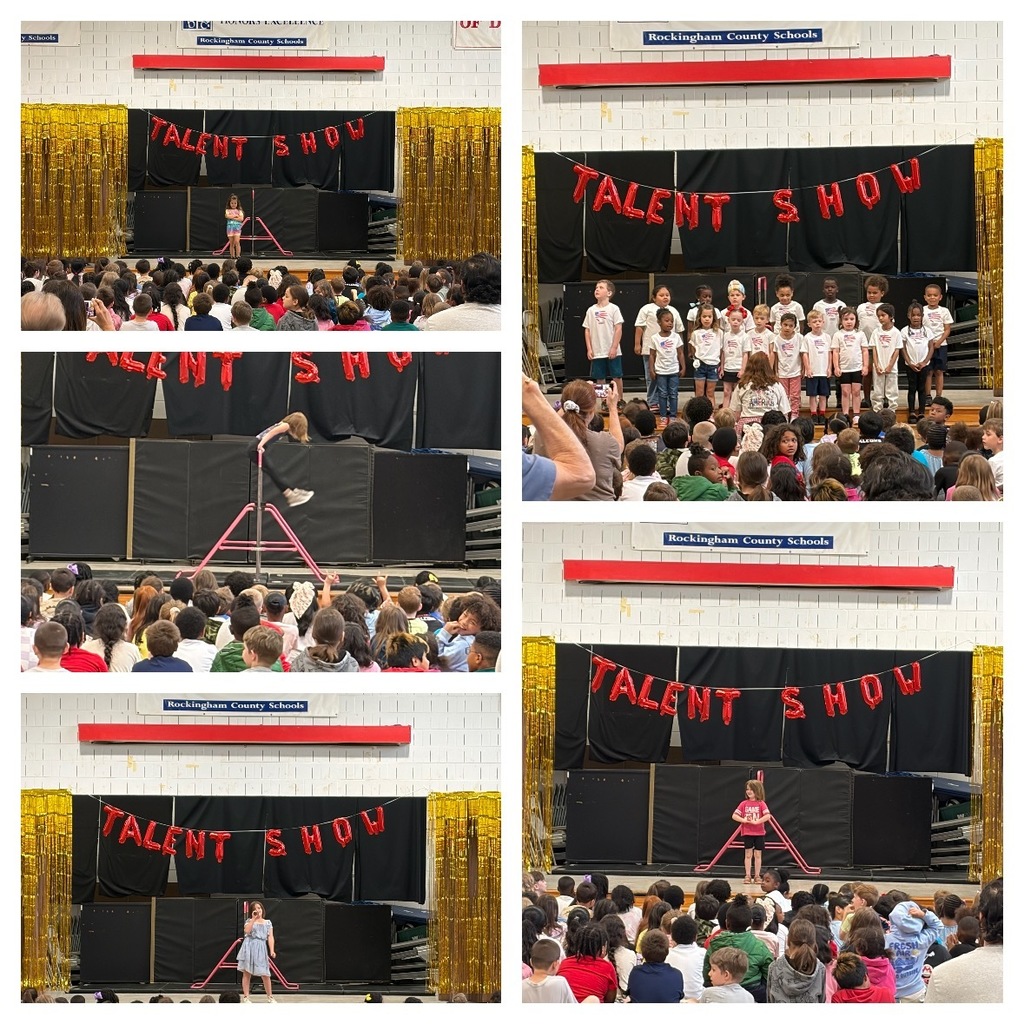 Students perform a variety of acts during a school talent show in the gym. A red “Talent Show” balloon banner hangs against a black backdrop with gold streamers on each side.