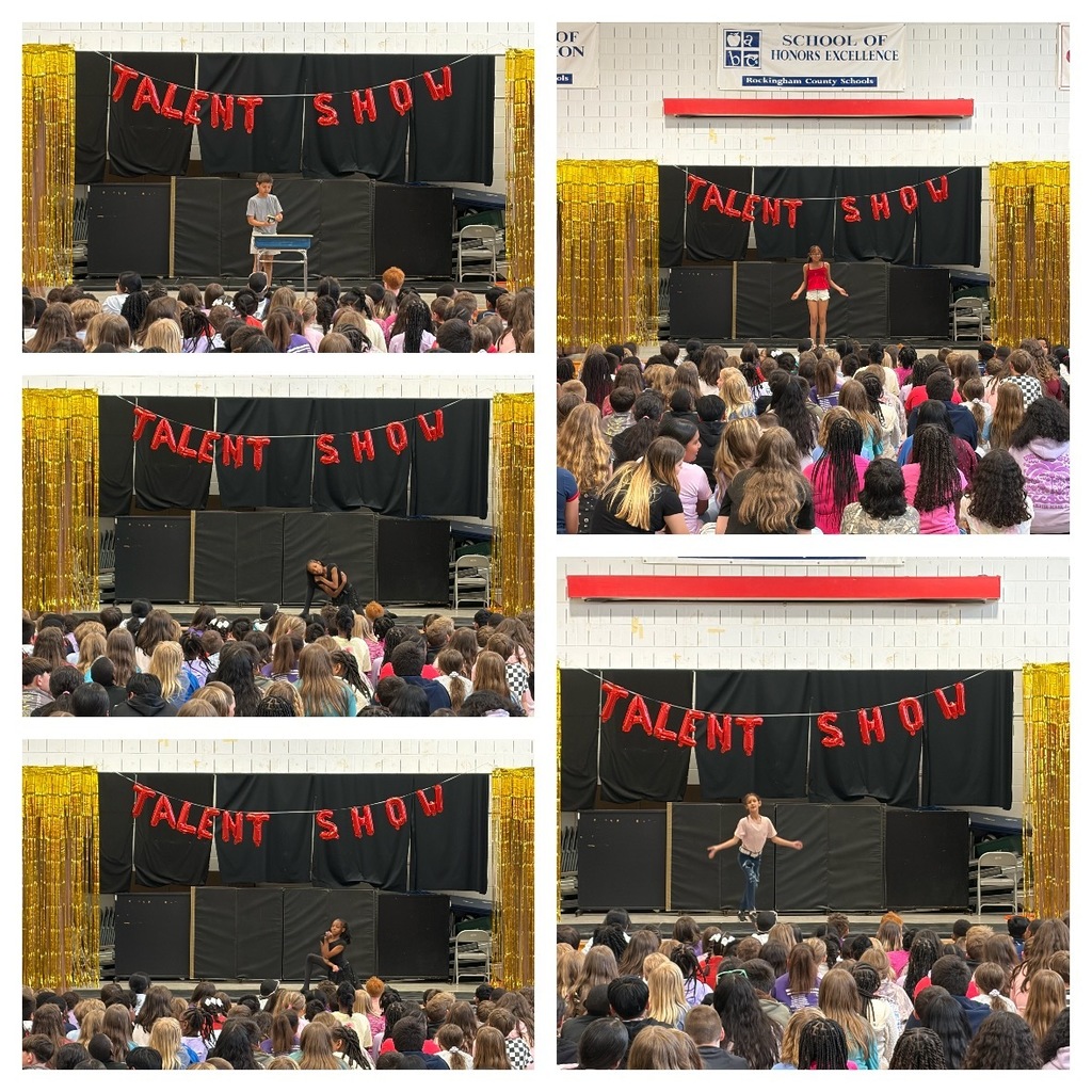 Students perform dance routines and other acts on stage during the school talent show while classmates sit on the gym floor watching. Performances include individual dancers striking poses and a student presenting at a table beneath a red “Talent Show” balloon banner and gold decorations.