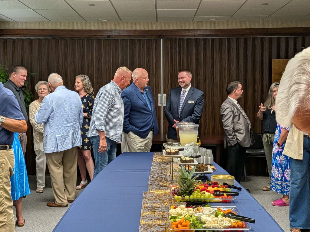 Superintendent Dr. Charles Perkins, State Rep. Reece Pyrtle, and guests at RCS Central Office public reception