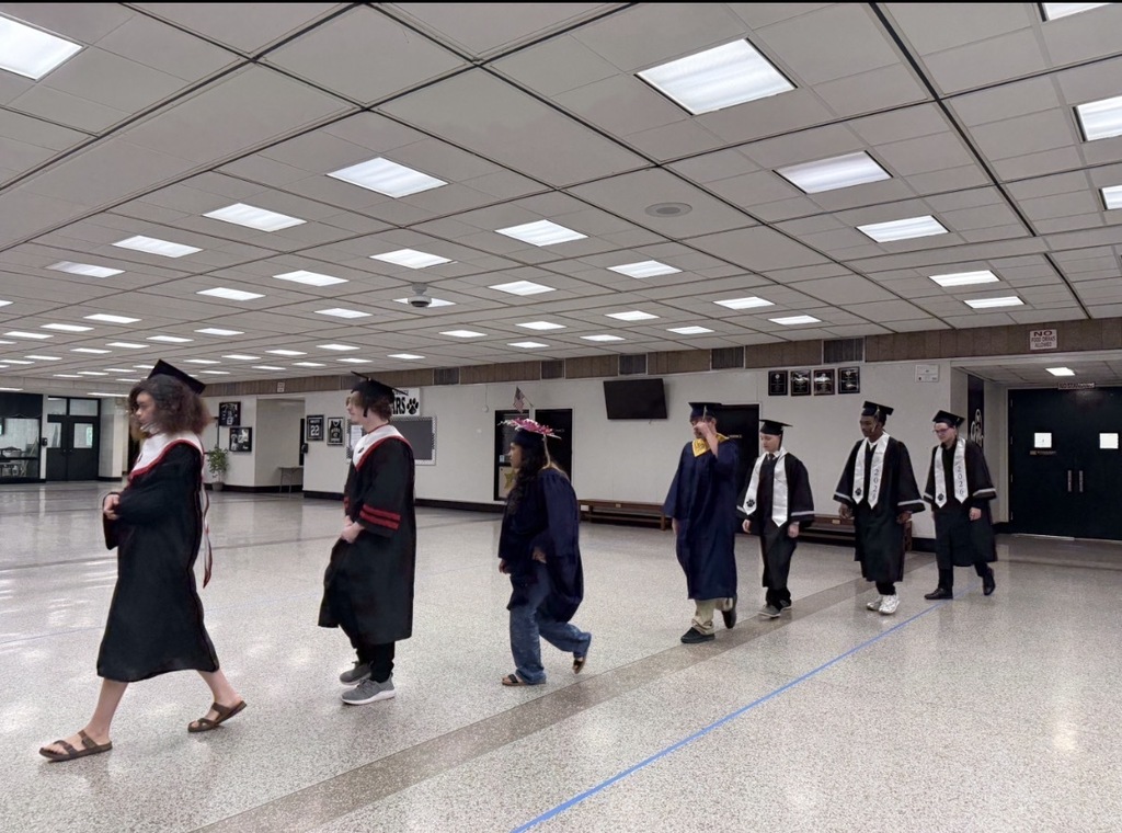 RCS Summer Graduates walk into the Rockingham County High School auditorium.