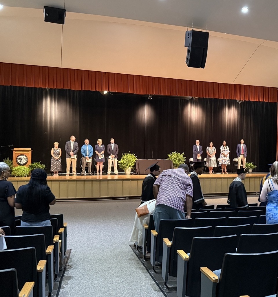 RCS leadership and graduates' families attend summer graduation.