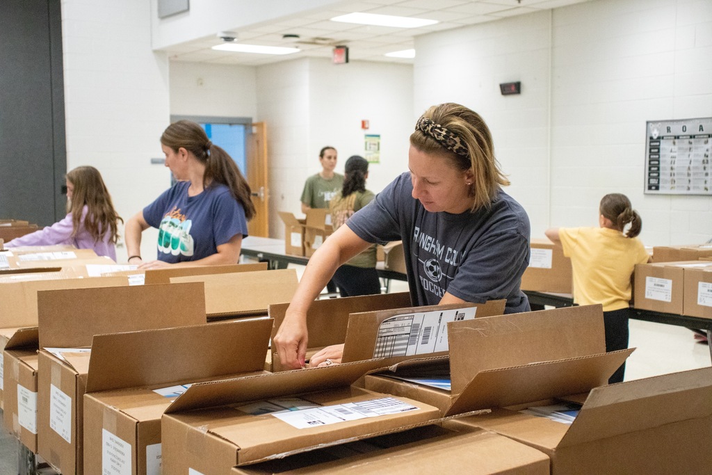 volunteers unpacking boxes
