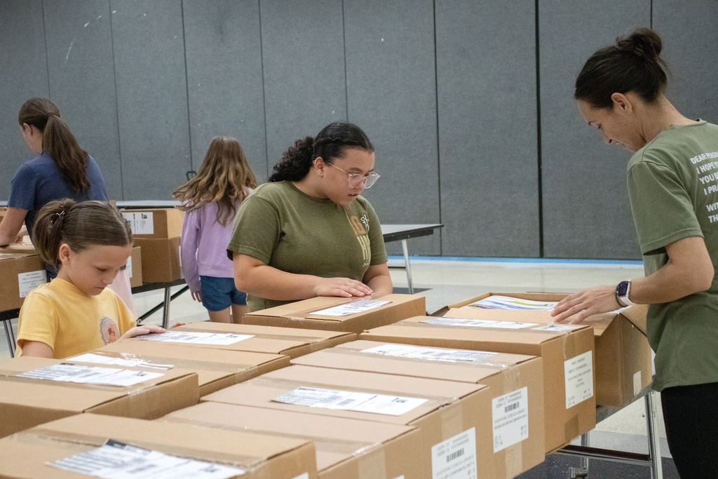 volunteers opening boxes