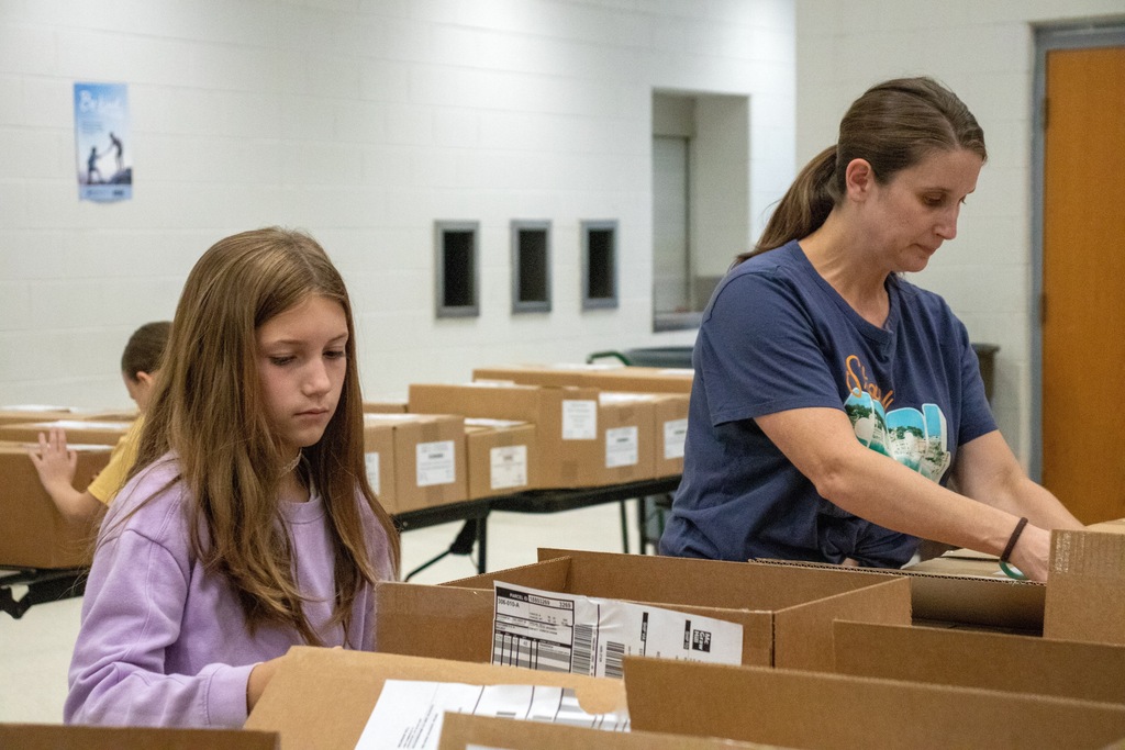 volunteers unpacking boxes