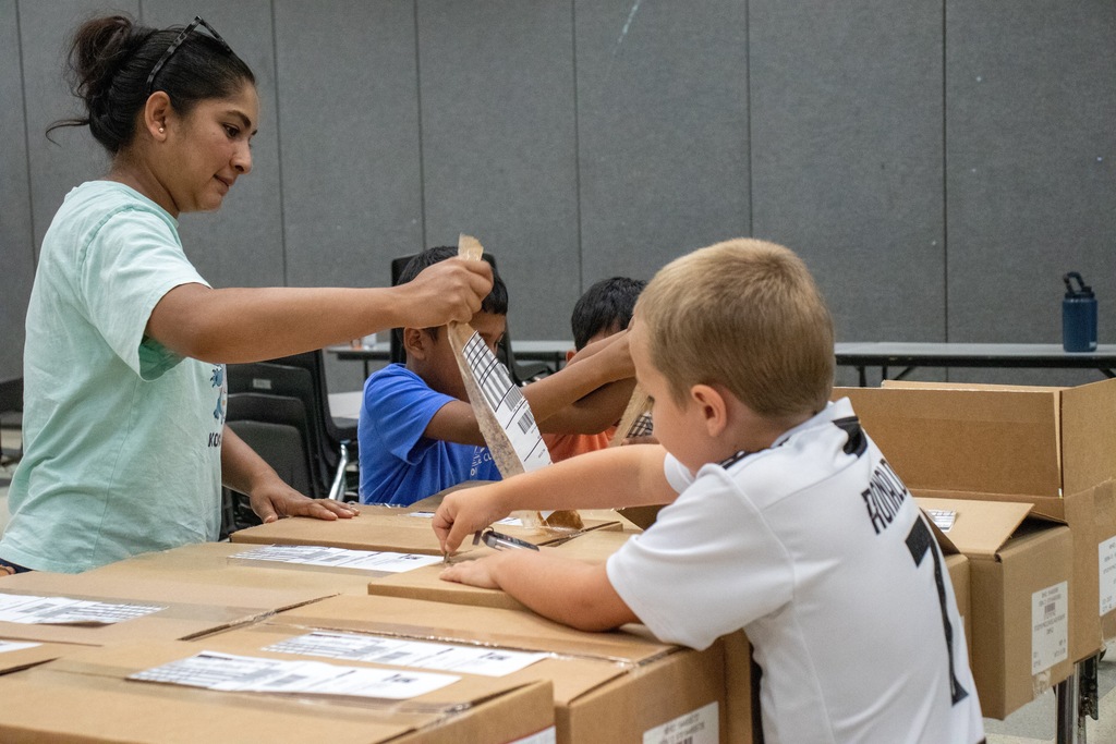 volunteers opening boxes