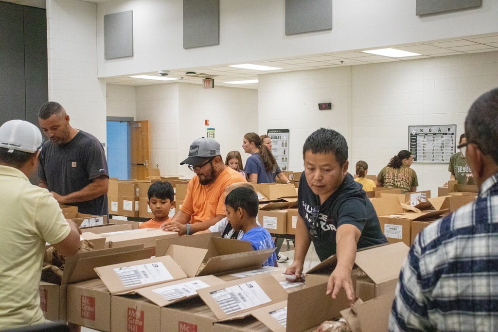 volunteers opening boxes