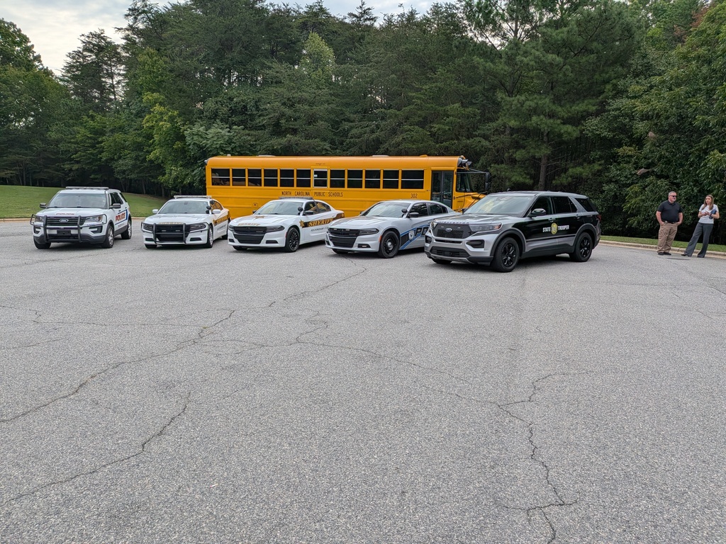 Local law enforcement vehicles and RCS school bus at School Safety press conference Aug. 20th at Rockingham Co. Middle School