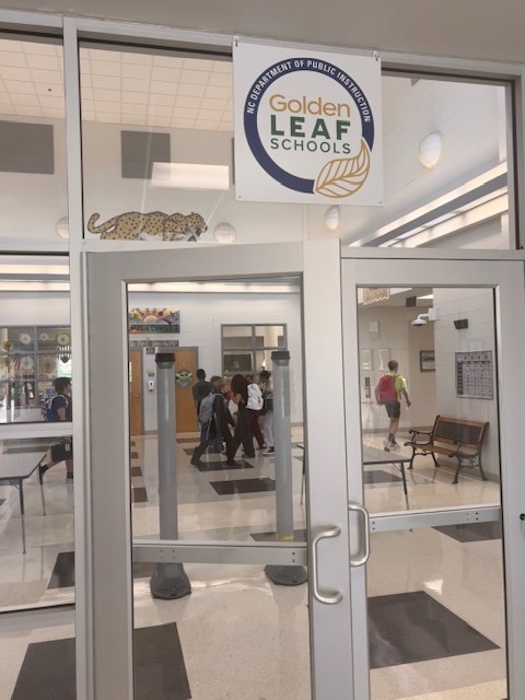 picture of the golden leaf sign over the front entrance of the school