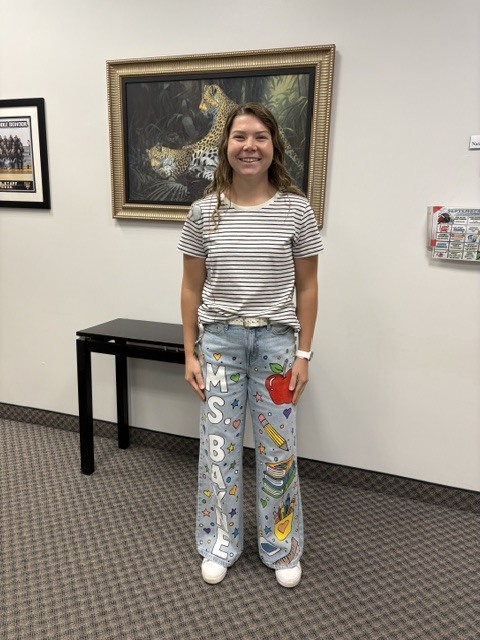 guidance secretary wearing her back to school painted jeans and matching shirt