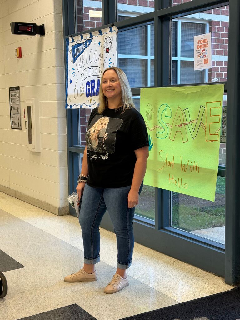 guidance counselor wearing a dolly parton tshirt