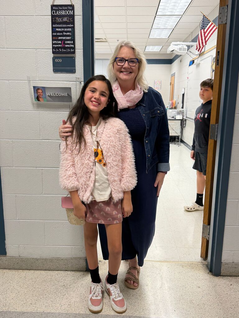 students and teachers in the hallway dressed in western wear