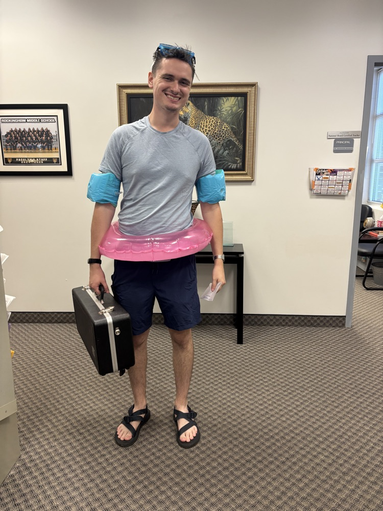 Mr Williams in pool floaties and goggles